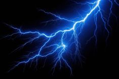 lightning strikes across the night sky with bright blue lights and long, thin lines on black background