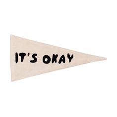 it's okay sign hanging from the side of a white flag with black writing