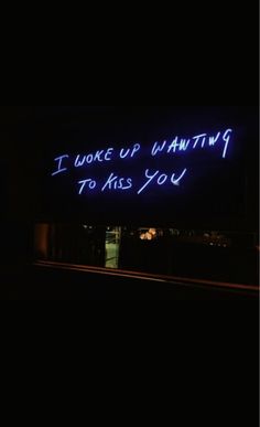 a neon sign that says i woke up waiting to kiss you