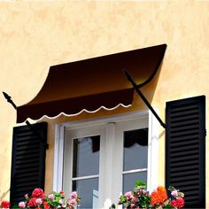 an open window with black shutters and flowers on the windowsill below it is a brown awning