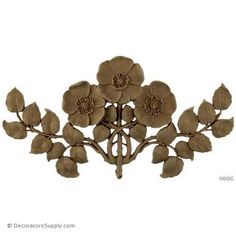 a decorative piece with flowers and leaves on it's back end, made out of metal