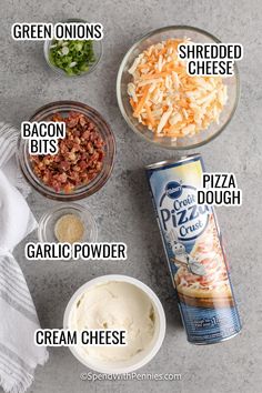 ingredients to make pizza dough laid out on a counter top, including cream cheese, bacon bits, and shredded cheese