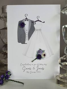 a wedding card with an image of a dress and tuxedo