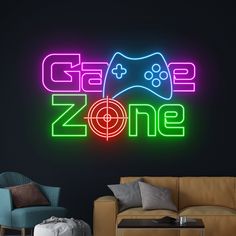 a neon sign that says game zone next to a couch