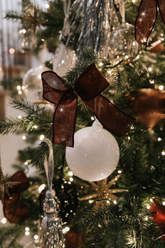 a christmas tree with ornaments and lights on it