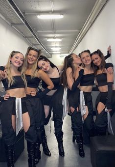 a group of young women standing next to each other