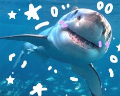 a great white shark swimming in the ocean with stars and confetti around it's mouth