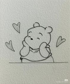 winnie the pooh sitting at a table with hearts flying around