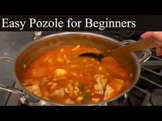 a person stirring a pot of food on top of an open stove with the words easy pozole for beginners