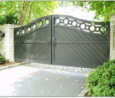 an iron gate in front of a house