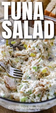 tuna salad in a glass bowl with a fork