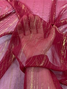 pink and gold sheer fabric with metallic stripes