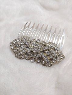 This piece is an authentic vintage 1920s art deco rhinestone hair comb. This is a 1920s art deco rhinestone brooch, repurposed. The piece is loaded with stones and has been set on a new silver tone metal comb. Please see all pictures on this piece for a better description and sizing. Art Deco Bridesmaids, Authentic Art, Rhinestone Hair Comb, Art Deco Dress, Metal Comb, Rhinestone Hair, 1920s Art, Etsy Bridesmaid Gifts, 1920s Art Deco