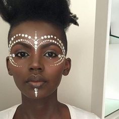 pretty-period:  somebody please tell me who this beauty is!  #PrettyPeriod http://ift.tt/1TAWKbI African Face Paint, African Makeup, White Face Paint, Face Jewelry, Carnival Makeup, Festival Makeup, White Face