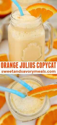 an orange juice is in a mason jar with two straws