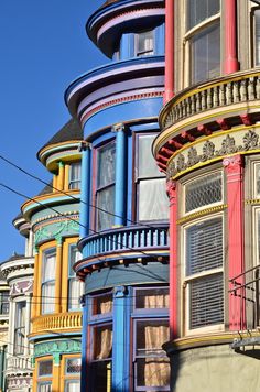 many multicolored buildings with windows and balconies