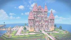 a large pink castle sitting on top of a lush green field