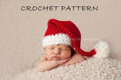 a newborn baby wearing a red and white crochet santa hat