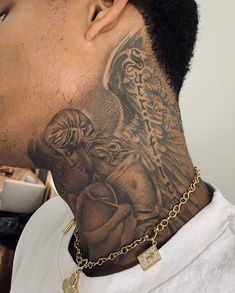 a man with a tattoo on his neck