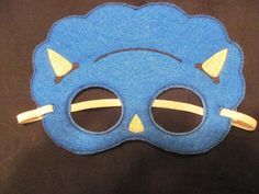 a blue mask with yellow horns on it