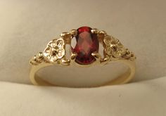 100% Australia Made BRAND  NEW  GENUINE  SOLID  9ct YELLOW GOLD   BEAUTIFULLY CRAFTED NATURAL GARNET DAISY DRESS RING Quality Ring HIGHLY POLISHED crafted with Precision & Detail  Suitable for every day wear and all ages. Will make a wonderful gift GENUINE SOLID GOLD   NOT FILLED   NOT HOLLOW   NOT PLATED   HALLMARKED (Stamped) 9ct Ring Weight : 1.6 grams to 1.8 grams approx. depending on size Ring Width : 6 mm widest point tapering to 1.5 mm Gemstone : Natural Garnet (6x4 oval 0.5ct approx.) Av Vintage Gold Rings, Cute Engagement Rings, Daisy Dress, Victorian Rings, Birthday Ring, Garnet Jewelry, Dress Rings, Garnet Rings, Lovely Jewellery