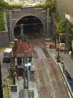 an overhead view of a train station and tracks