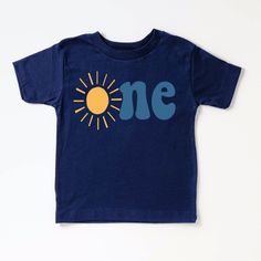 Celebrate your little one's 1st birthday in style with this adorable sun shirt! Perfect for a fun and sunny birthday party, this shirt features a cheerful design that will make your little one stand out. Made with soft and breathable fabric, this shirt is both cute and comfortable for your baby to wear all day long. Add a special touch to your little one's birthday celebration with this 1st birthday sun shirt! + Machine washable & dryer safe (I recommend drying on delicate) + Design color will d Blue Short Sleeve T-shirt For First Birthday, Blue Summer T-shirt For First Birthday, Playful Short Sleeve Top For First Birthday, Fun Cotton Tops For First Birthday, Summer Fun Playtime Shirt, Playful Summer Shirt For Playtime, Fun Summer Playtime Shirt, Blue Cotton T-shirt For First Birthday, Casual Summer Shirt For First Birthday