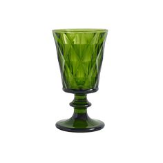 a green glass vase sitting on top of a table