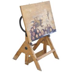 a wooden easel with a painting on it