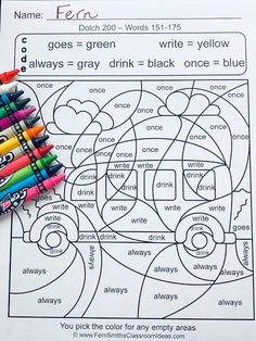 color by numbers worksheet with markers and crayons on top of it