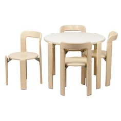 a white table and chairs are shown with one chair in front of the rest of the table