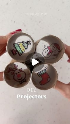 someone is holding four glass balls with christmas designs on them and the words, diy projects