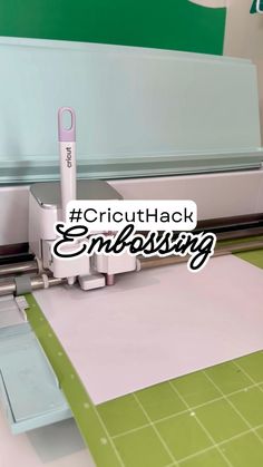 the cricuthack embossing machine is cutting paper with a pink pen