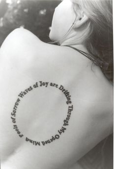 a woman with a tattoo on her back that reads, the words joy are different