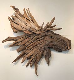 a piece of driftwood that is on the wall