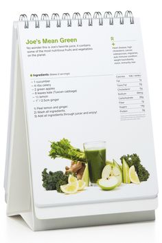 a recipe book with green juice and vegetables on it