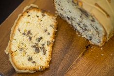 a piece of cake sitting on top of a wooden cutting board