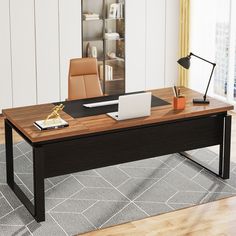 an office desk with a laptop on it