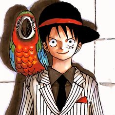 a man in a suit and hat standing next to an orange parrot on his shoulder