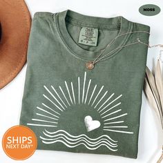 Our handmade Sunshine tshirts ship the same or next business day and are made to order just for you! Our trendy Hiking shirts are made from an ultra soft 50/50 blend which will quickly make this your go to Beach long sleeve! We print all our threads with 100% eco-friendly water based ink. This means our ink is PVC free, safer to wear, and more sustainable for the environment. This makes all our garments both incredibly breathable and super long lasting! ♥Details♥ - 50/50 blend premium sweatshirt - Hand pressed with eco-friendly water-based ink ♥ Sizing ♥ -All our sweatshirts are unisex sizing.  -For a more fitted look, we recommend ordering your normal size. -If you prefer a baggy/oversized look then we recommend sizing up! - Check the sizing chart for exact dimensions ♥ HOW TO ORDER: - Se Custom Print Summer Top For Everyday, Custom Print Summer Tops For Everyday, Custom Print Top For Everyday Summer Wear, Custom Print Tops For Everyday Summer Wear, Cotton Shirt With Custom Print For Beach Season, Beach Season Cotton Tops With Custom Print, Custom Printed Cotton Tops For Beach Season, Cotton Tops With Custom Print For Beach Season, Green Cotton Shirt For Beach Season