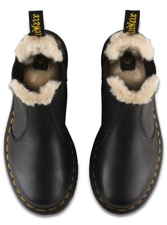 The Leonore Chelsea boot combines the androgynous elements of the style with a slender, feminine silhouette. In other words? An uncompromisingly fashion-forward look and feel. Then, we winterized it, lining it in soft, artificial white fur. Lined with soft faux fur Made with classic Doc's DNA, including grooved edges, visible stitching and heel-loop Built on the iconic Dr. Martens air-cushioned sole, which is oil and fat resistant with good abrasion and slip resistance Material Leather with a su Fall Winter Shoes, Dr Martens Womens, Boots Uk, Baby Phat, White Fur, High Leg Boots, Flat Boots, Winter Shoes, Autumn Fashion Women