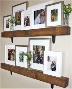 several pictures are hanging on the wall with wooden shelves holding plants and vases filled with flowers