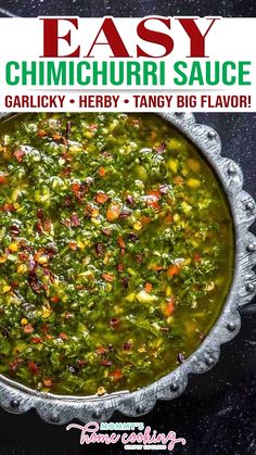 a bowl filled with green sauce on top of a black counter next to a red and white sign