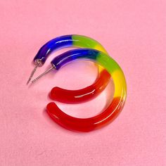 These Lovely LGBTQ+ Rainbow Pride Hoop Earrings are adorned with all 6 colors of the Pride Flag. Made with Resin and Hypoallergenic stainless steel ear posts, you are sure to stand out from the crowd! The Perfect statement piece to compliment your vibe.  These earrings are handcrafted with love in mind and light in my heart right in my home studio.  Makes a great gift for your bestie or to show love & support for a loved one! Flaunt Your Pride Year Round!  **Pairs great with our matching pride r Cheap Rainbow Jewelry For Pride, Pride Jewelry Earrings, Lgbtq Jewelry, Lgbtq Pride Flag, Pride Jewelry, Jewelry Friendship, Lgbtq Rainbow, Pride Jewellery, Earrings Colorful