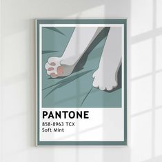 a pantone poster hanging on the wall above a bed