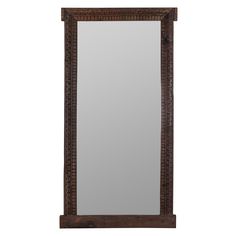 a mirror that is sitting on top of a wooden frame with an intricate design in the middle