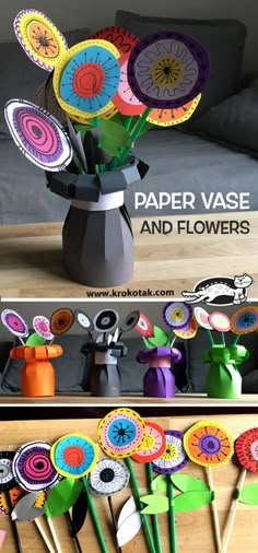 paper vases and flowers are sitting on the table