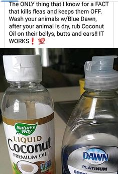 two bottles of coconut oil sitting on top of a counter next to eachother