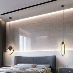 a bed sitting in the middle of a bedroom next to a wall mounted light fixture