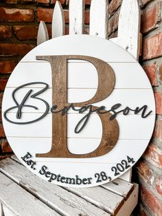 a wooden sign that says, bespens for november 28, 2014 on a bench